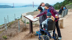 Park visitor using wheelchair accessible trail at Land's End