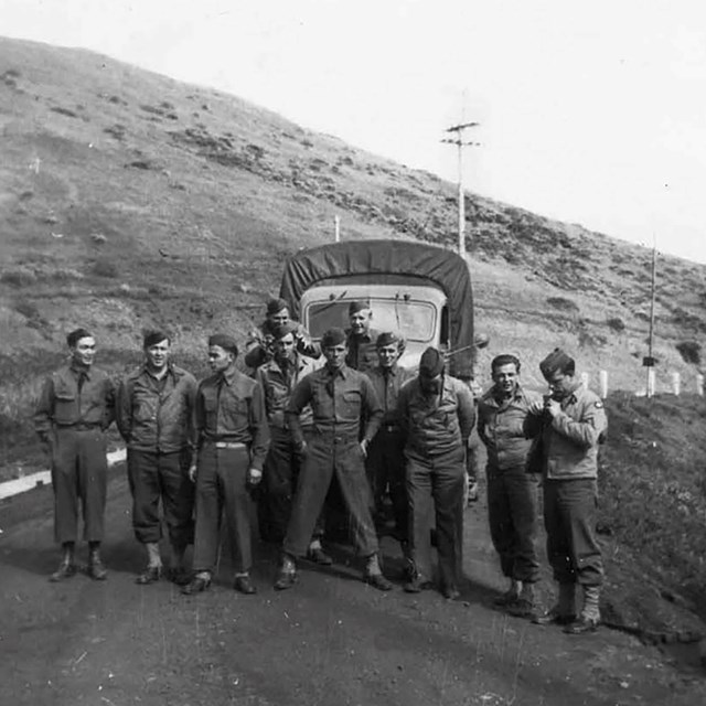 army men pose in front of truck at fort cronkhite