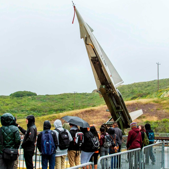 People lining up to see the nike missile 