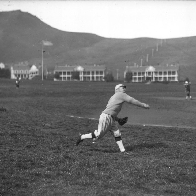 Historic photo of baseball player on Fort Baker parade ground