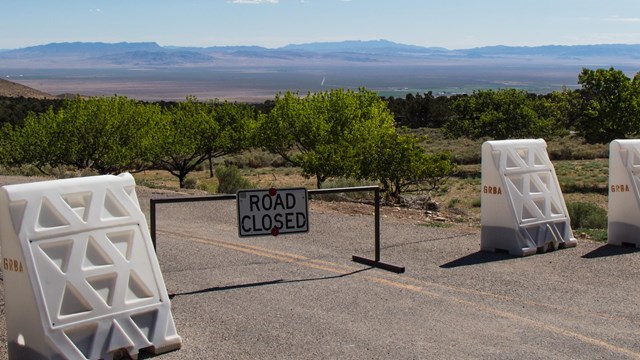 Road closed sign with white blockades