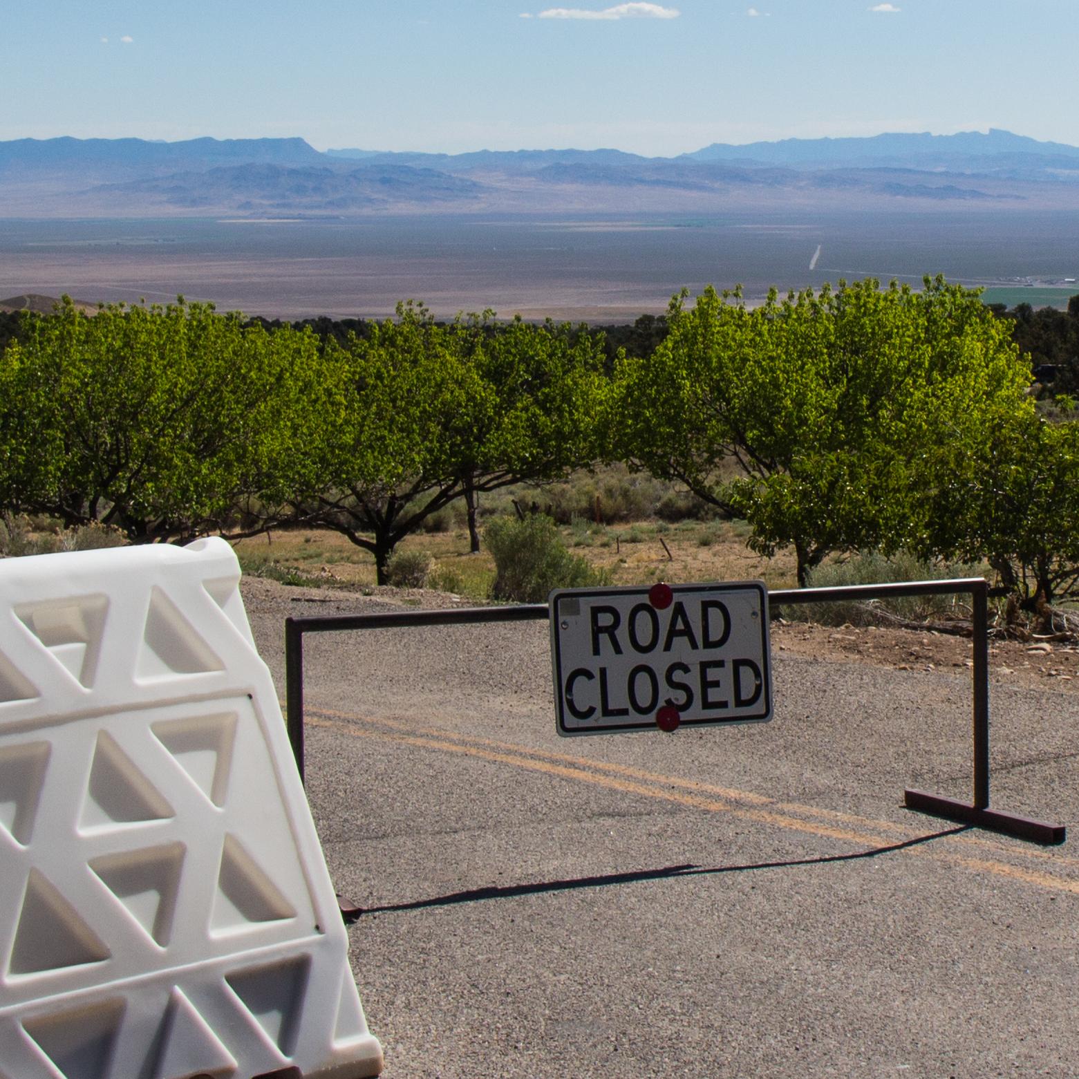 Road closed sign with white blockades