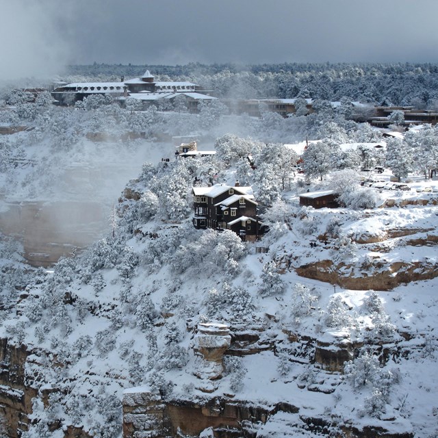 The side of the Grand Canyon in the snow.