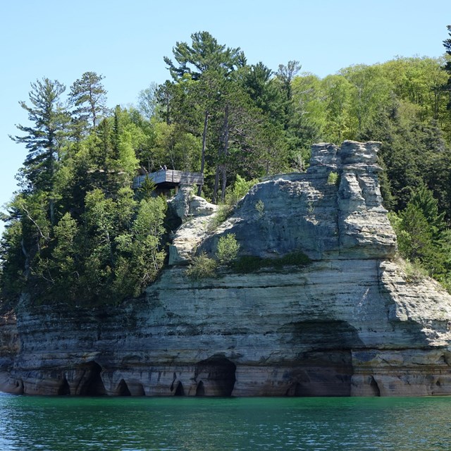 The rock turrets of Miners Castle from the water of Lake Superior
