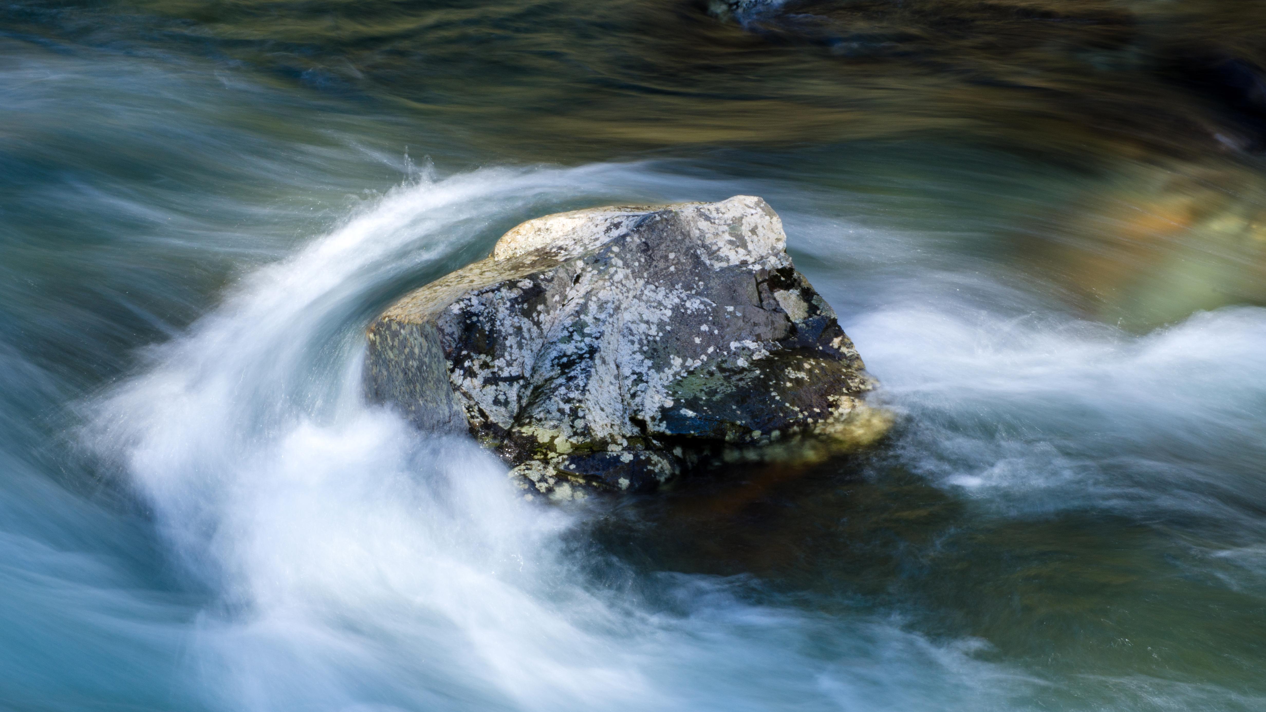 Water going around a rock.