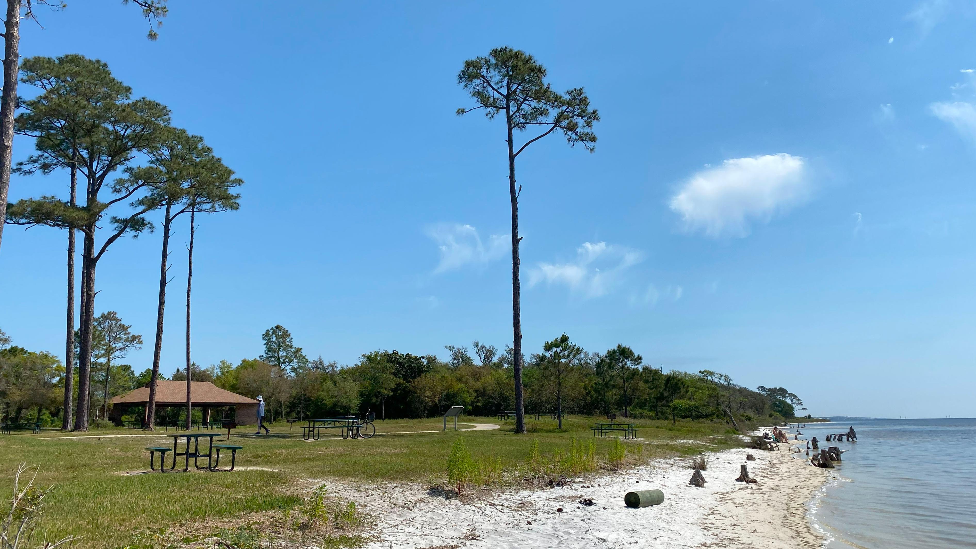 An overlook with waysides and a cloudy blue sky.