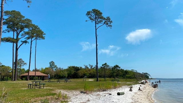 An overlook with waysides and a cloudy blue sky.