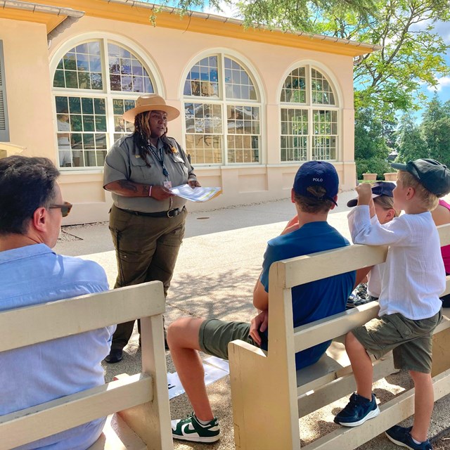 A ranger talking to visitors.
