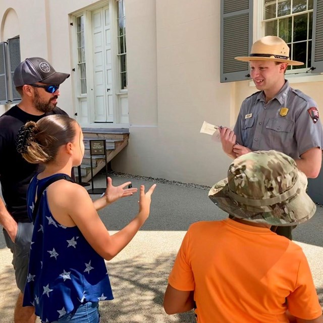 A Park Ranger talking to people
