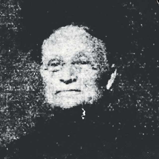 B/W portrait from a newspaper with the caption 