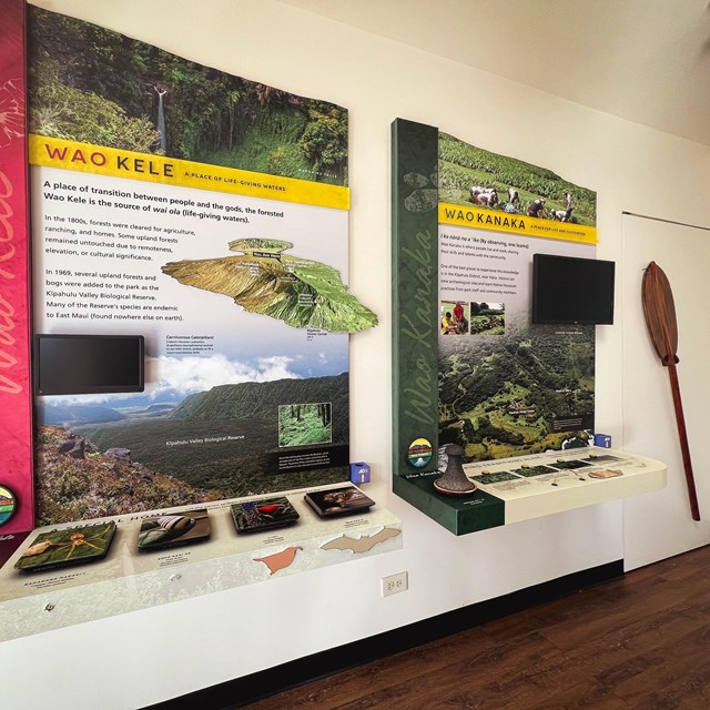 The interior of a visitor center featuring a bright exhibit with text