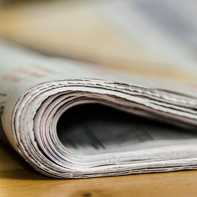 An image of a roll of newspaper.
