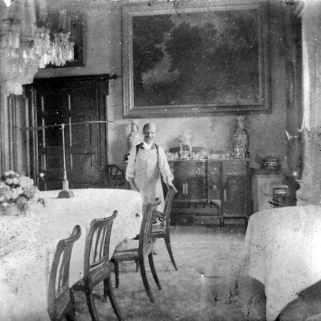 Photograph of Thomas Brown in the dining room in the Hampton Mansion, c. 1895, NPS.