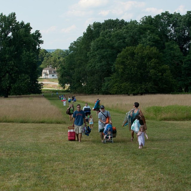 People walking through the meadow near Hampton NPS/Ervin