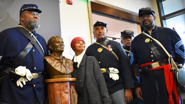 Harriet Tubman and United States Colored Troops reenactors dressed in period attire