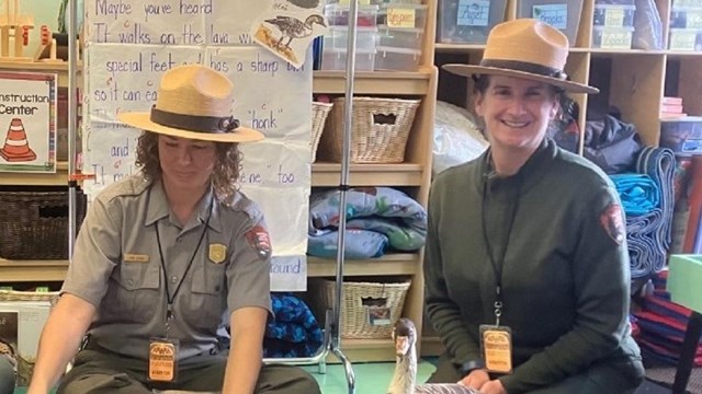 Three ranger sitting in a classroom