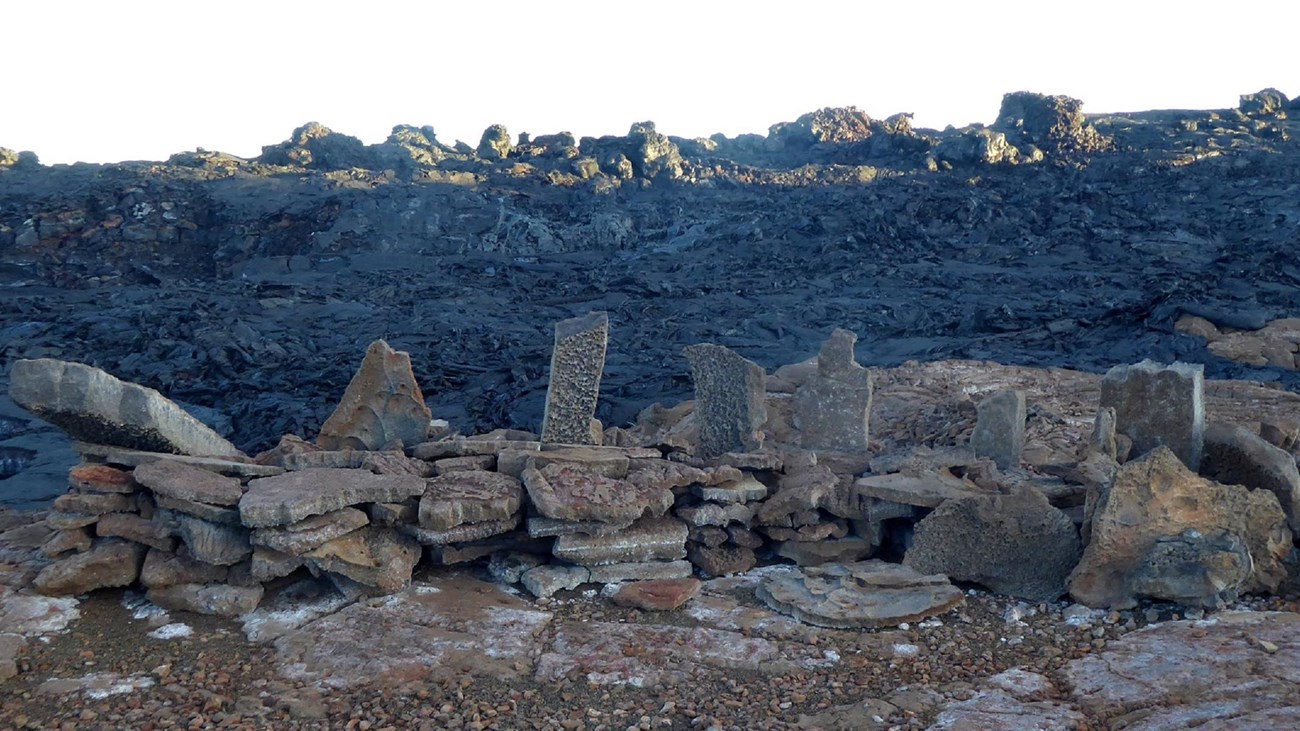 A stone altar surrounded by hardened lava flows. 