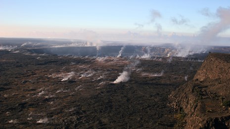 Steam rising from volcanic caldera