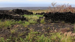Ruins of a stone structure in a lava field