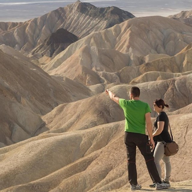 Man and woman look out towards Death Valley