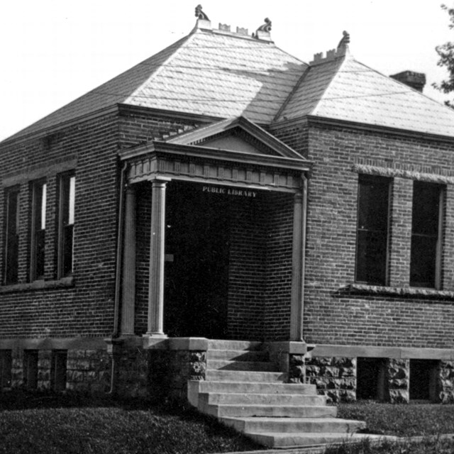 A 1908 photo shows a small town library building.