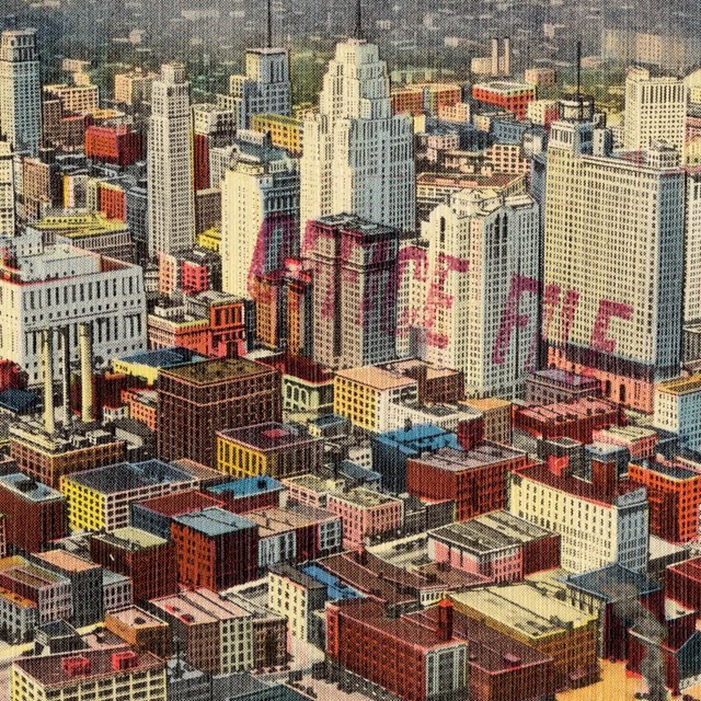 Historic postcard of downtown buildings. 
