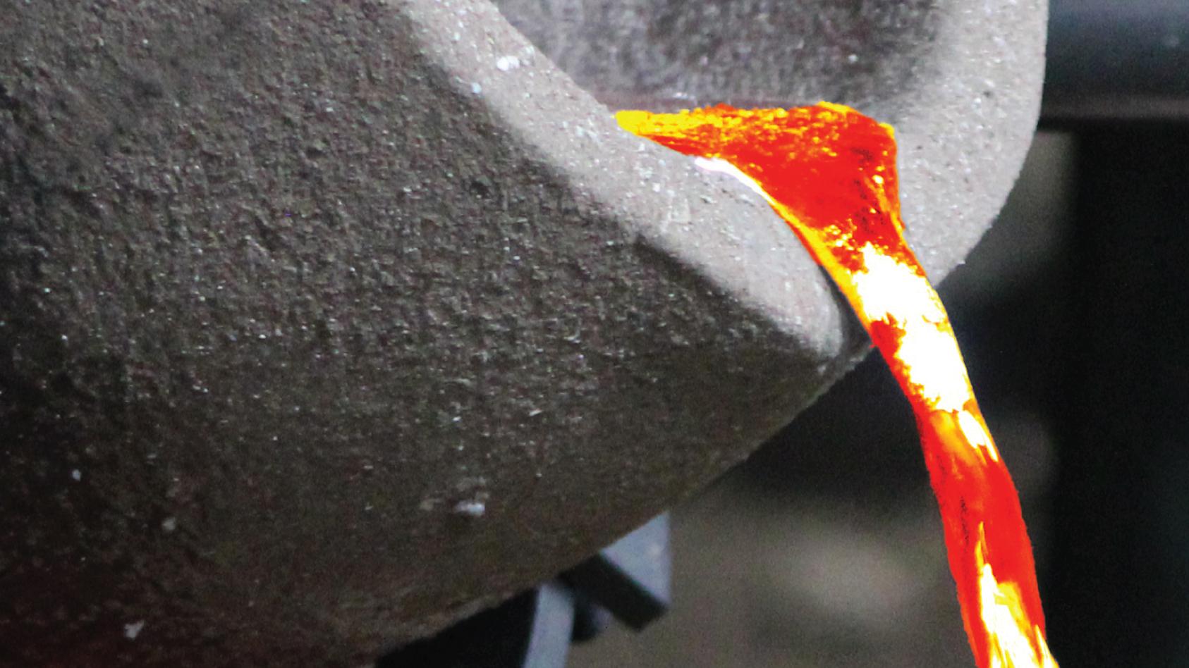 a large metal caldron pours red hot iron. 