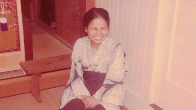 Haruko Takahashi sitting and smiling