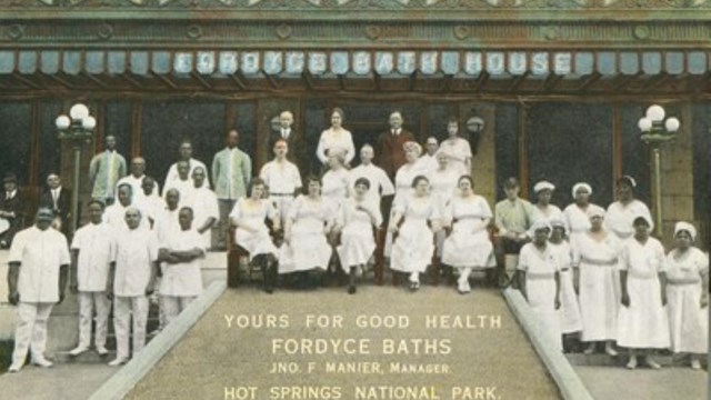 Fordyce employees from the mid 1900s gather outside the Bathhouse.