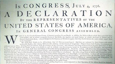 Color photo showing a detail of the Declaration of Independence printed document.
