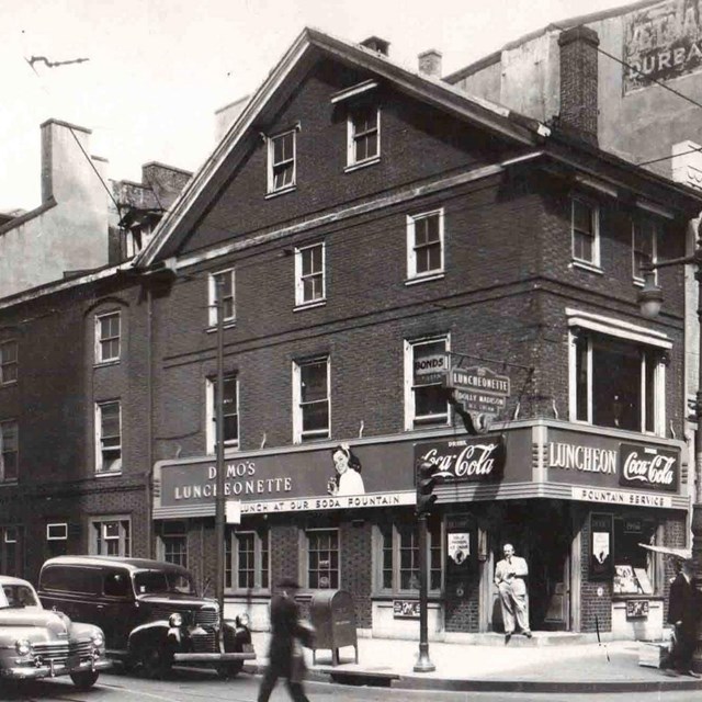 Black and white photo from 1947 showing the exterior of a brick building with a 