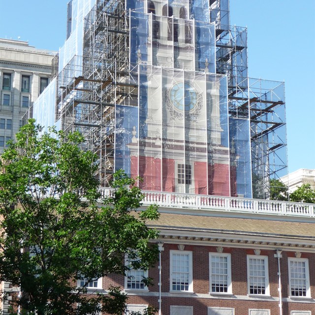 Color photo showing scaffolding around the Independence Hall tower.