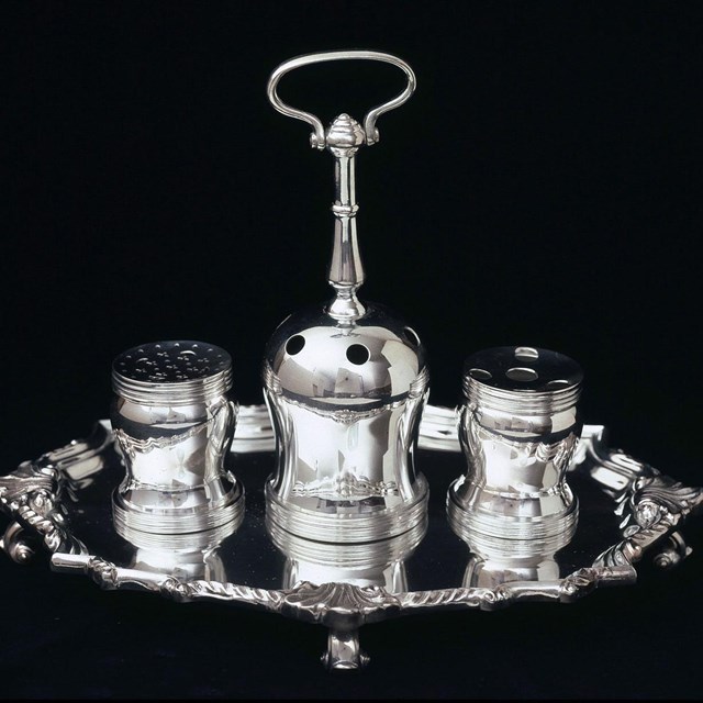 Photograph of the Syng Inkstand, with three silver containers for ink, quills, and sand.