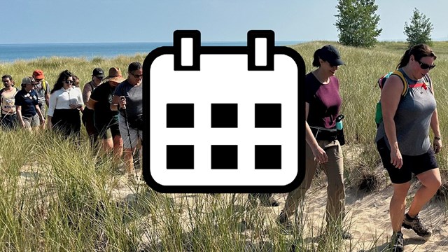 Map icon on background photo of interpretive park ranger teaching kids by Paul Kemiel.