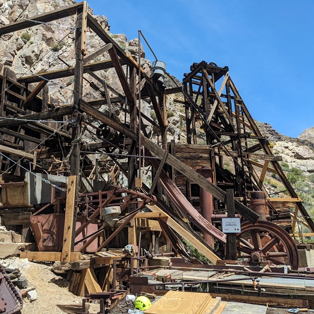 a large wooden structure built into the side of a rocky hill