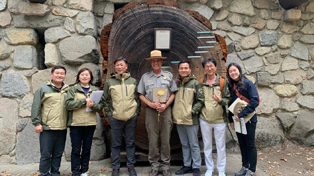 A park ranger stands with a delegation of Korean park rangers... 