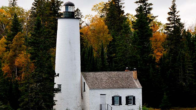 The Rock Harbor Lighthouse is white and located on Middle Island Passage on east end of Isle Royale.