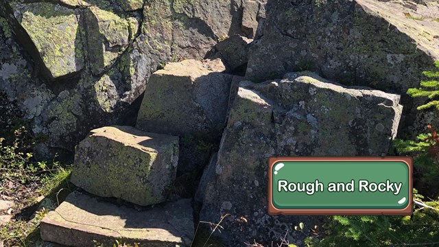A rocky, bouldery incline on a trail.
