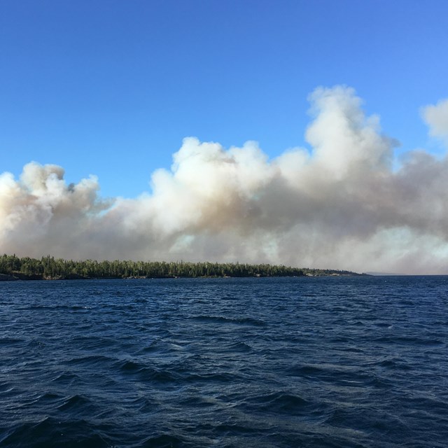 Smoke rises from an island.