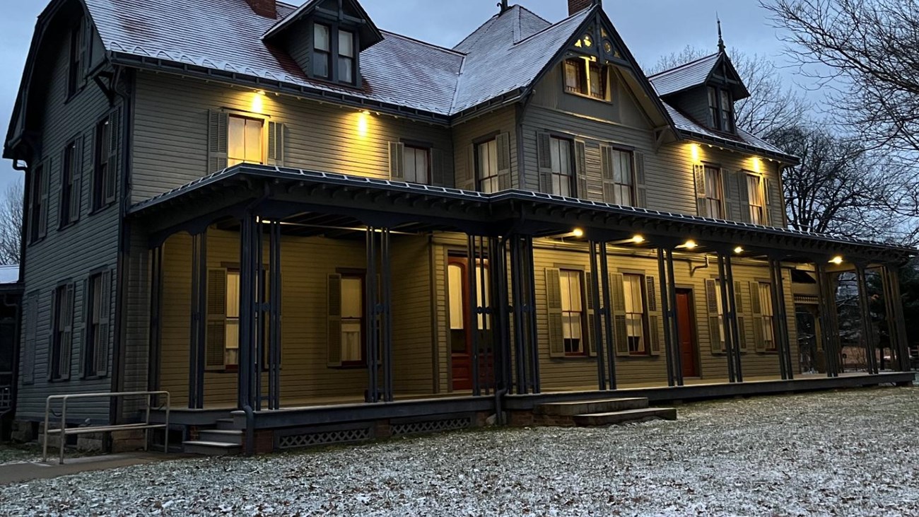 Front of Garfield home with a light dusting of snow on the grass.