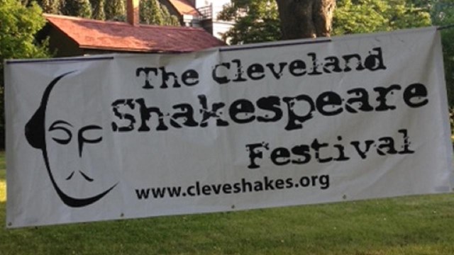 Fence banner announcing The Cleveland Shakespeare Festival