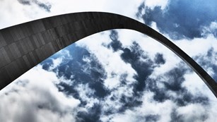 Photo of top part of the Arch and clouds