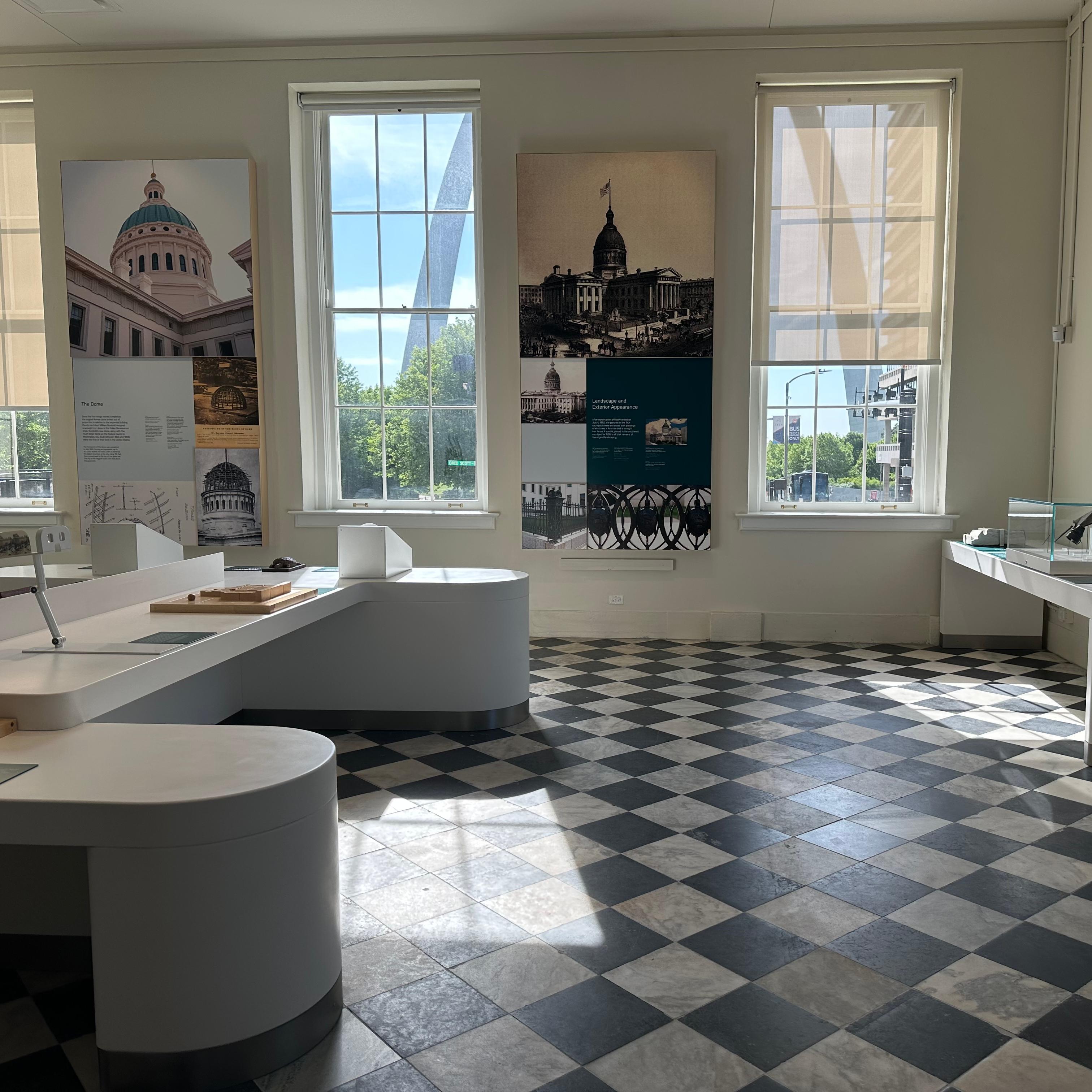 An exhibit gallery with a checkered floor