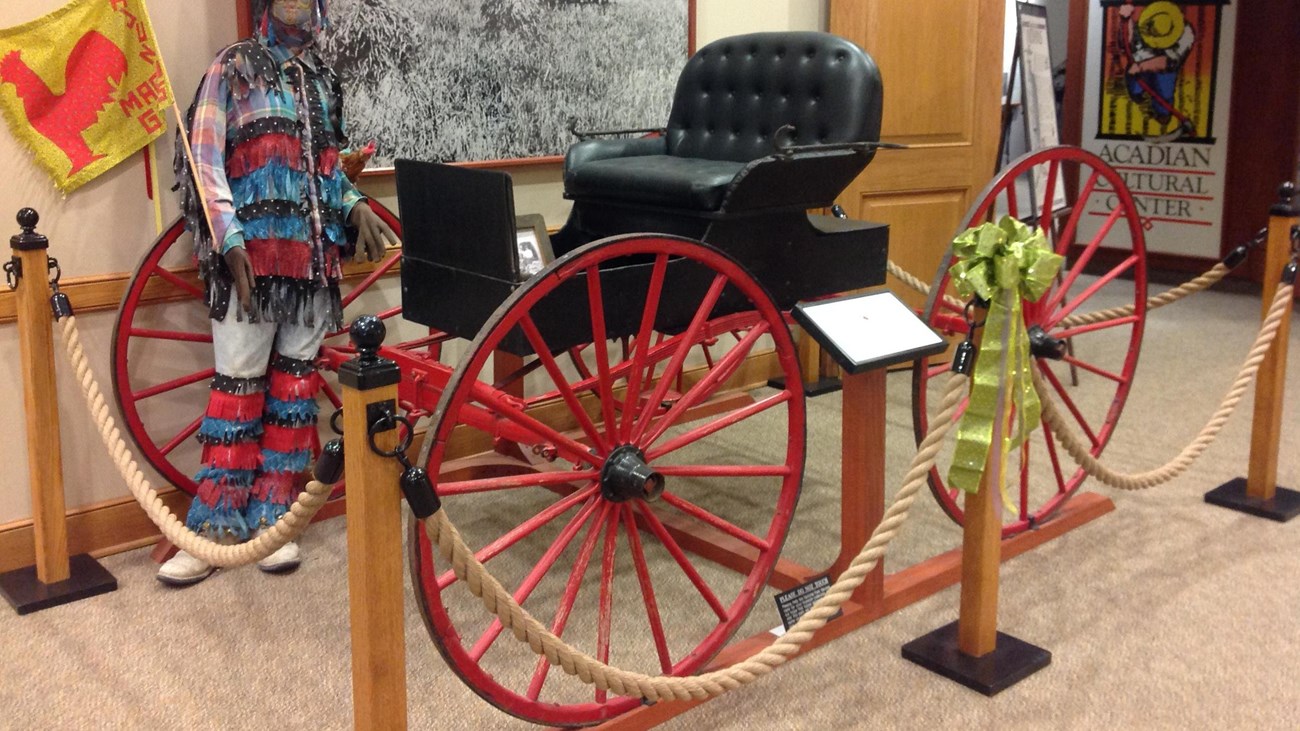 A horseless buggy on display