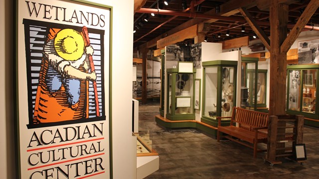 museum entrance sign with display cases in distance