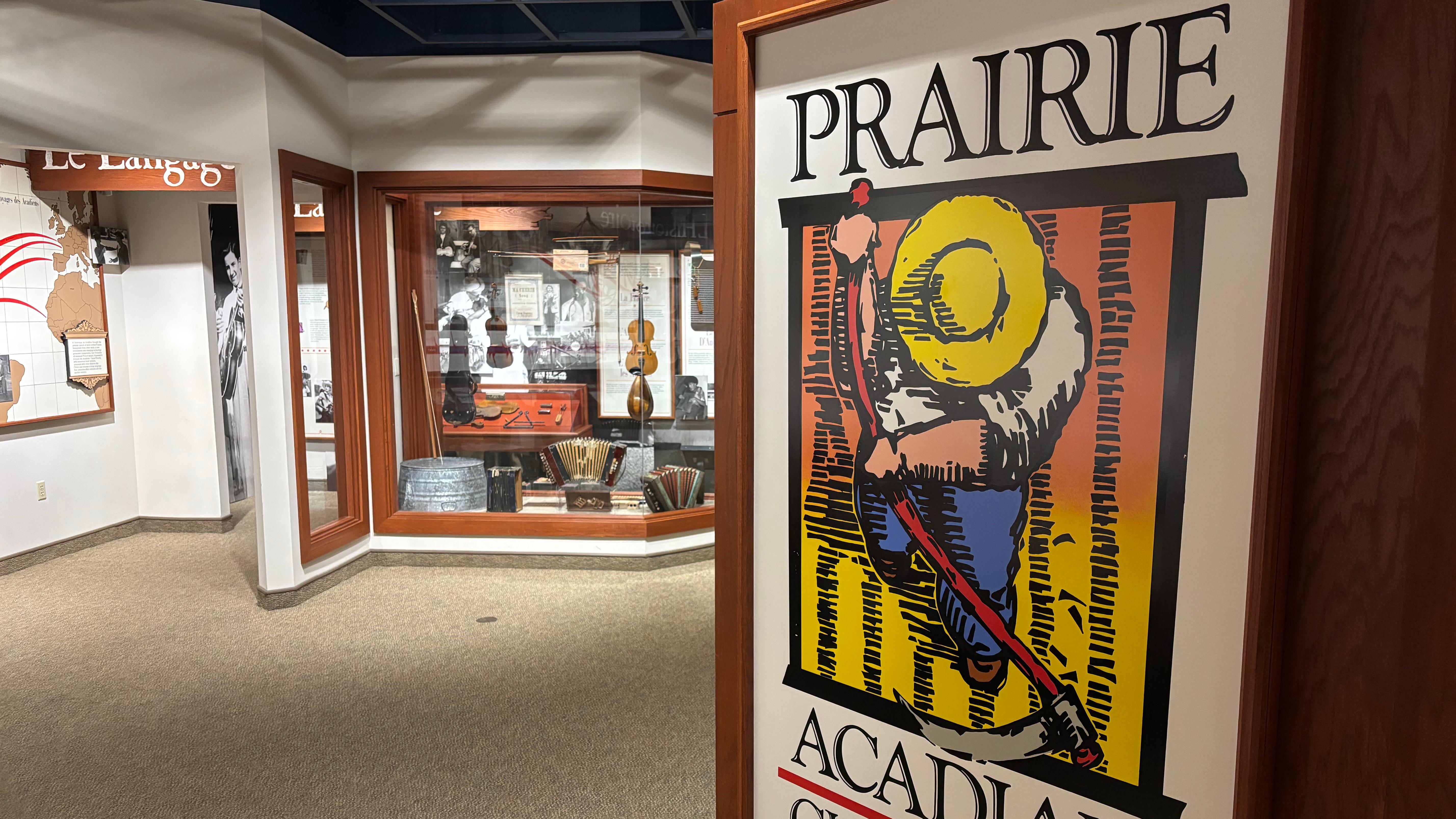museum entrance sign with music exhibit cases in the distance