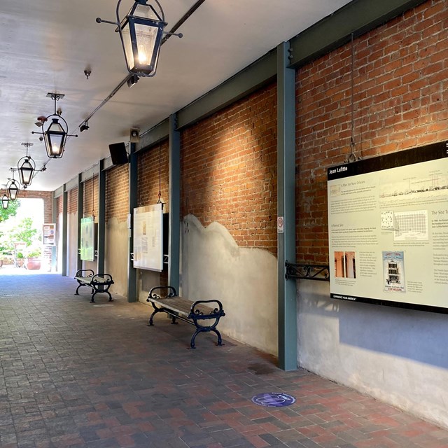 historic carriageway, gas lamps hang above and educational waysides line the walls.