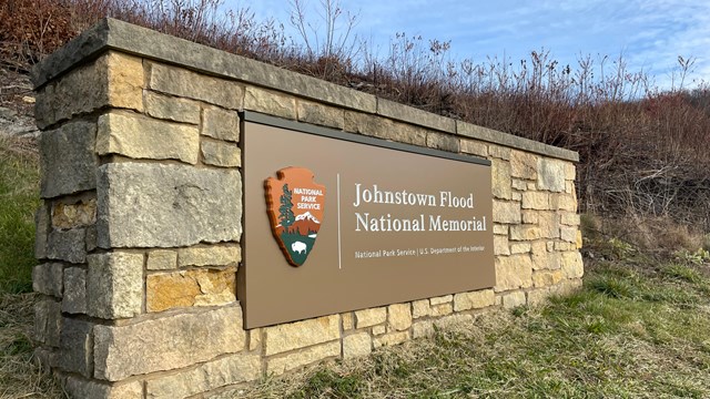 The park entrance sign made of stone