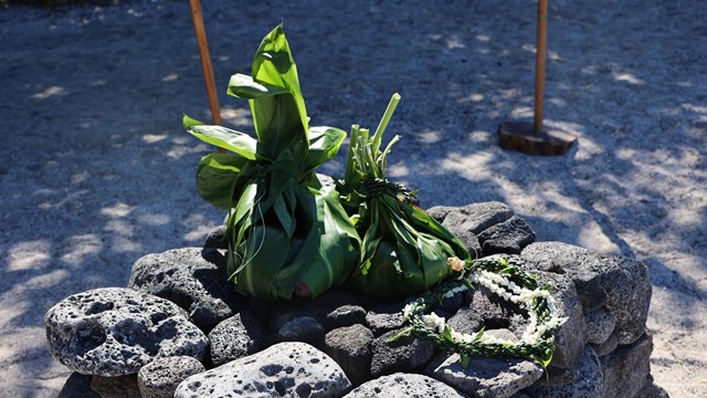 Traditional Hawaiian offering on an altar of lava rocks
