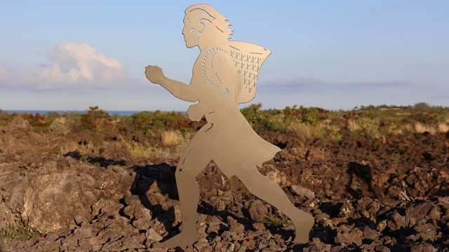 Silhouette statue of ancient Hawaiian runner